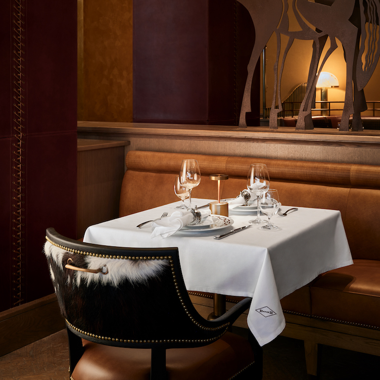 Candlelit table in a private dining corner